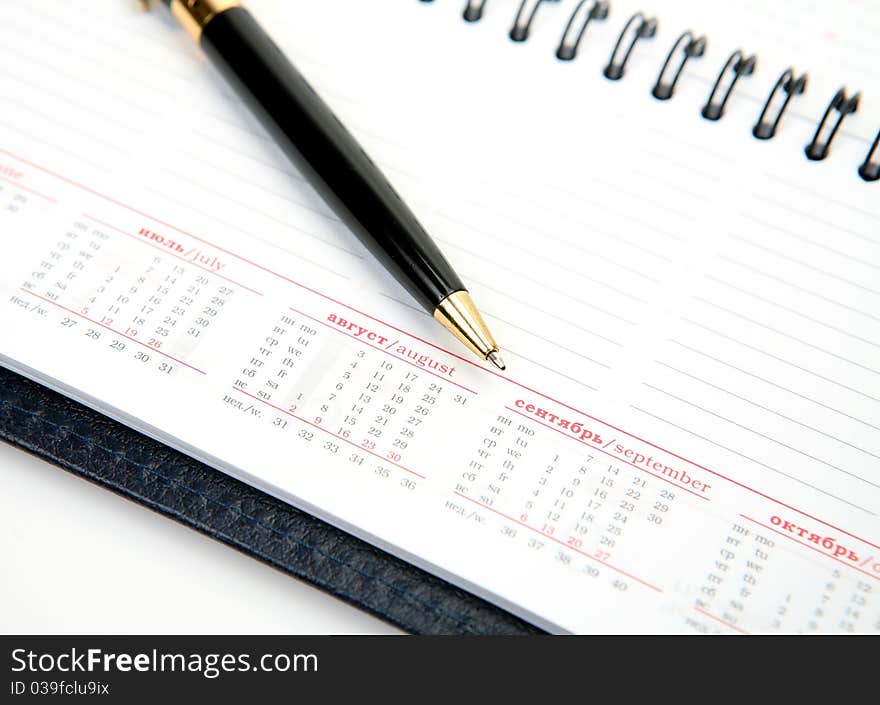 The handle and notebook on a white background