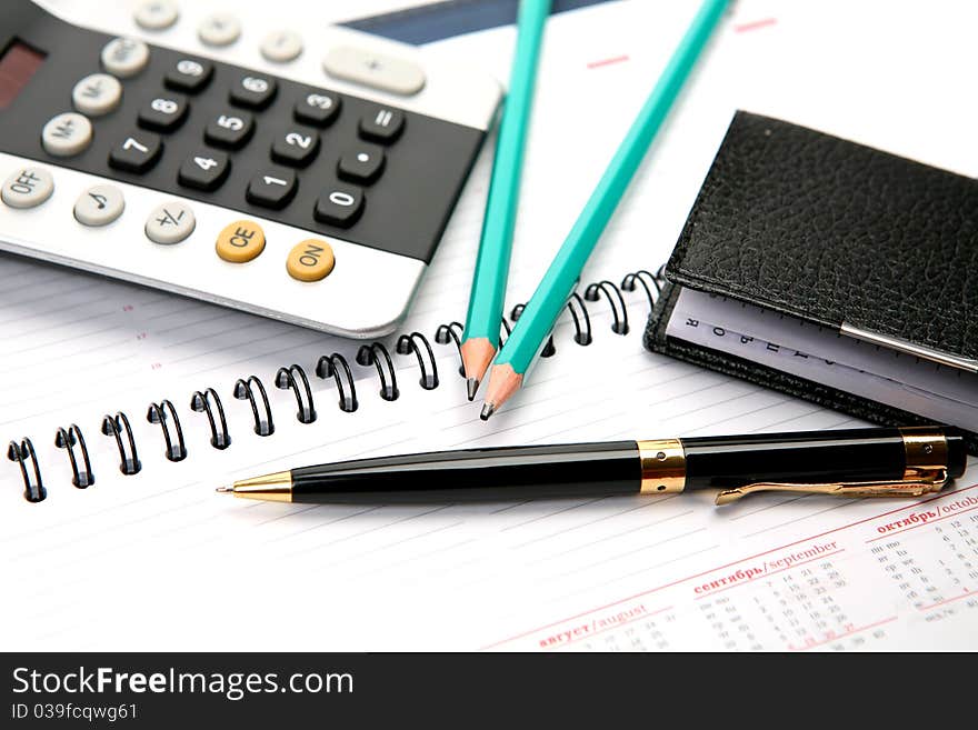 The handle and notebook on a white background. The handle and notebook on a white background