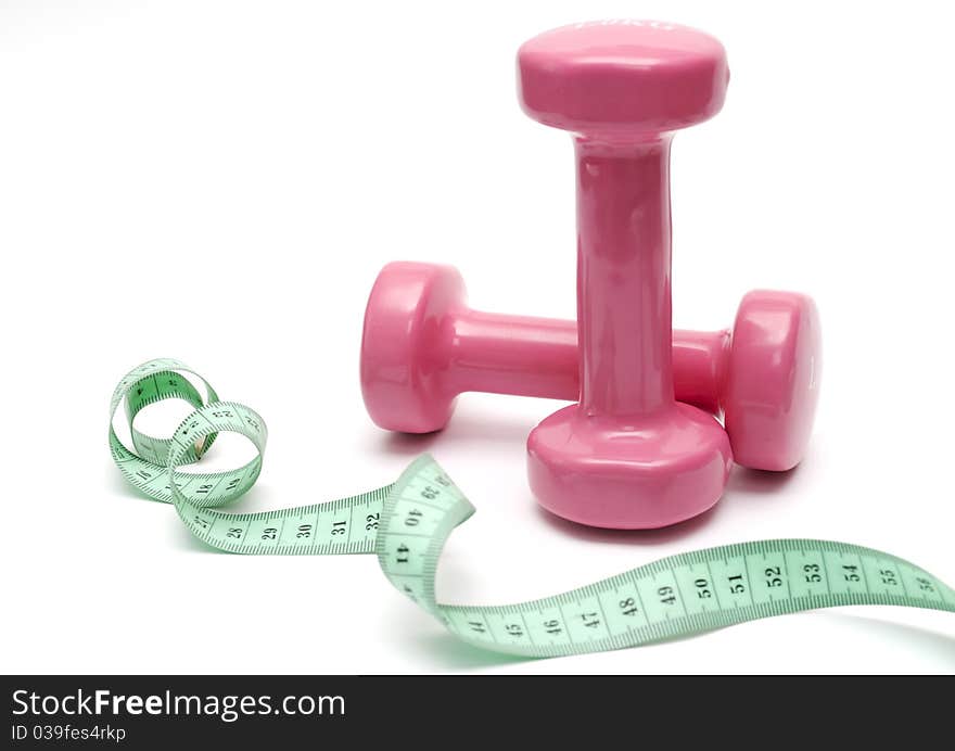 Two pink dumbbells on a white background