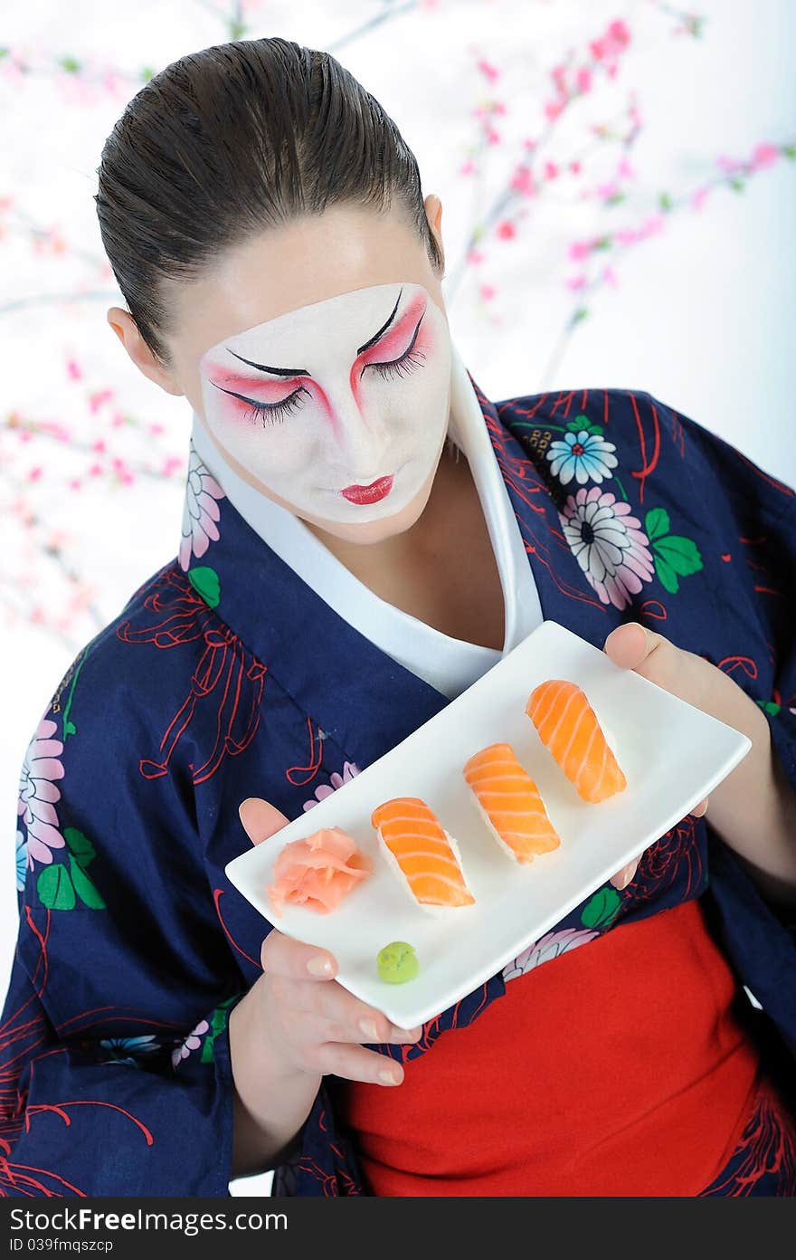 Beautiful japan geisha woman with sushi roll set