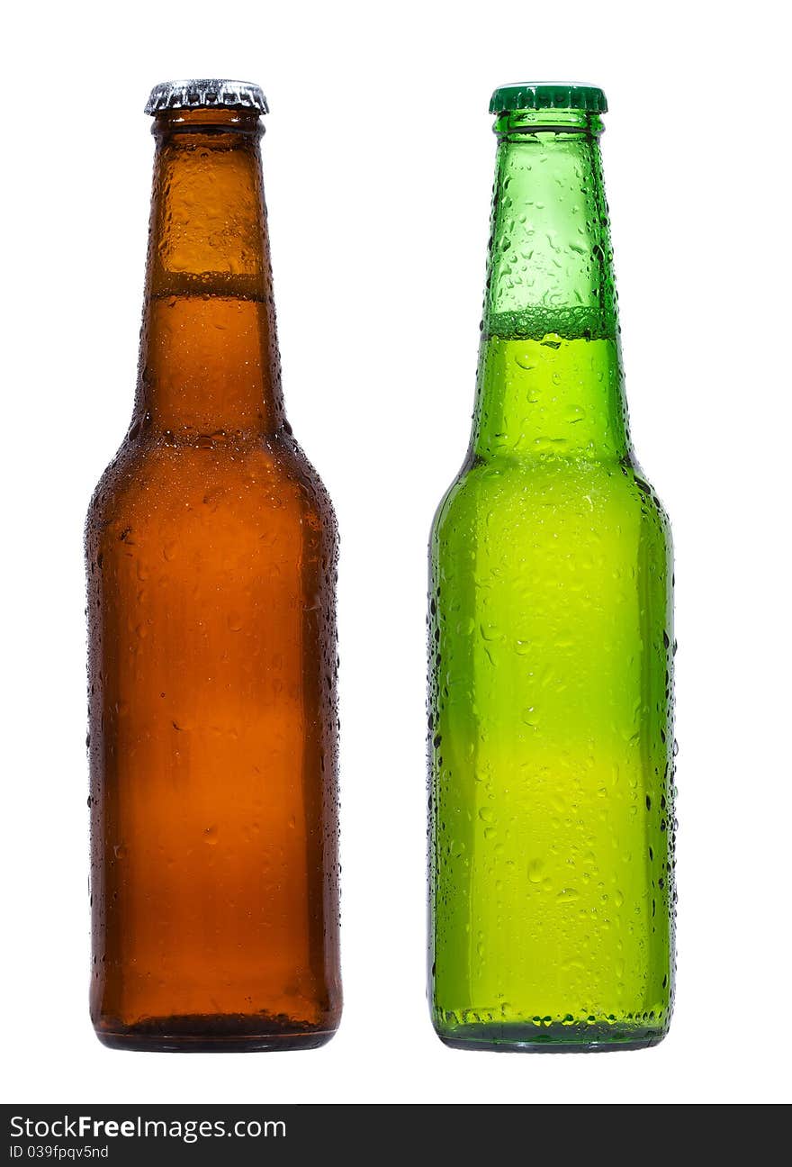 Bottles of beer with water drops on white background