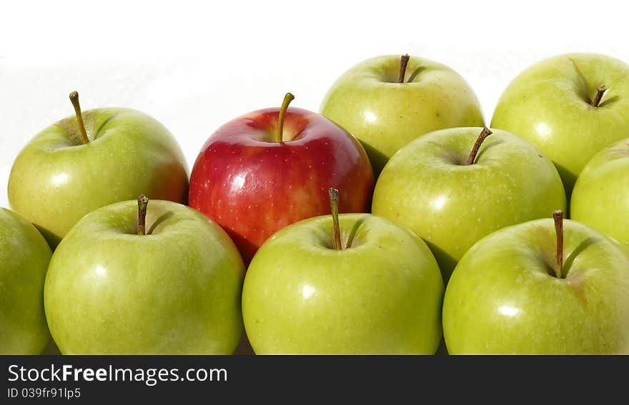 Green and red apples on a white background