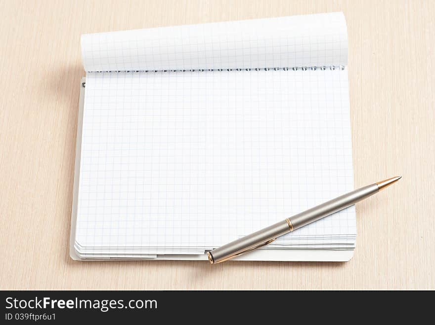 Blank spiral note pad and pen