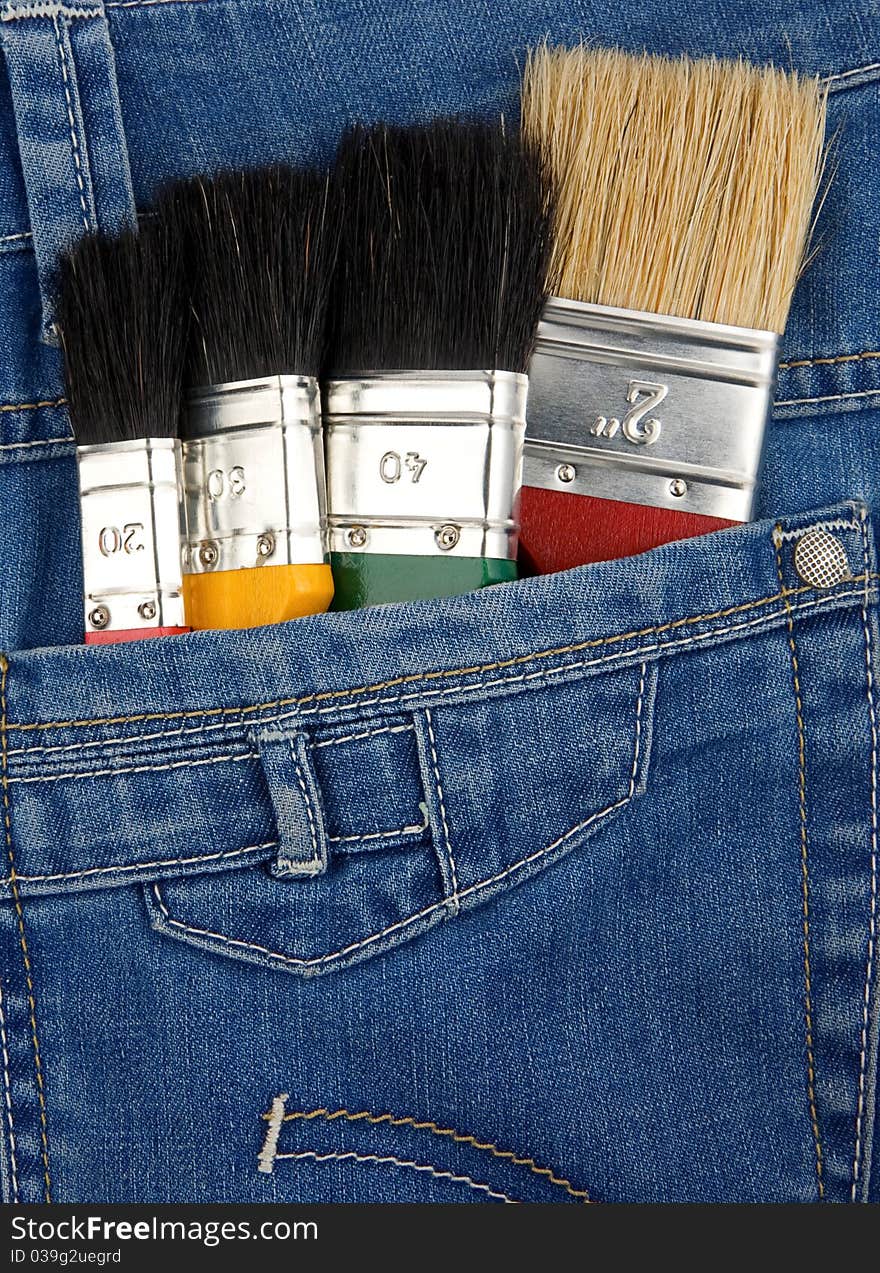 Paintbrushes on jeans texture