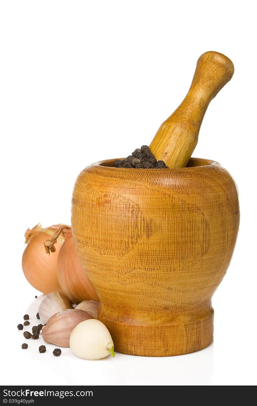 Garlic, onion and pepper in mortar and pestle