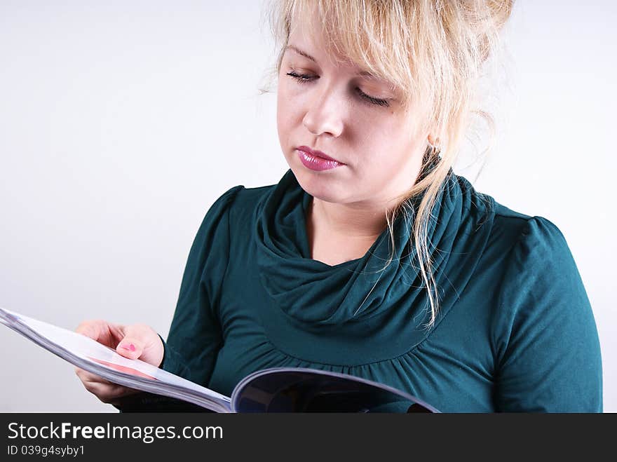 a girl reads a magazine