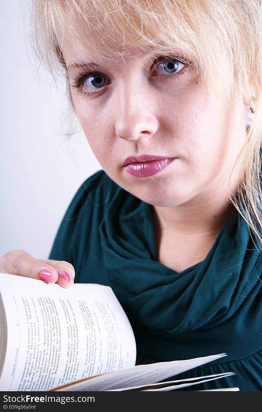 beautiful girl reading a book on a white background.