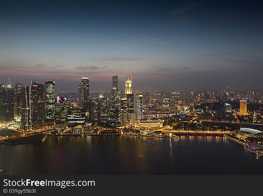 Singapore night view just before the sunset. Perfect view of Singapore busy financial district and tourist attractions.