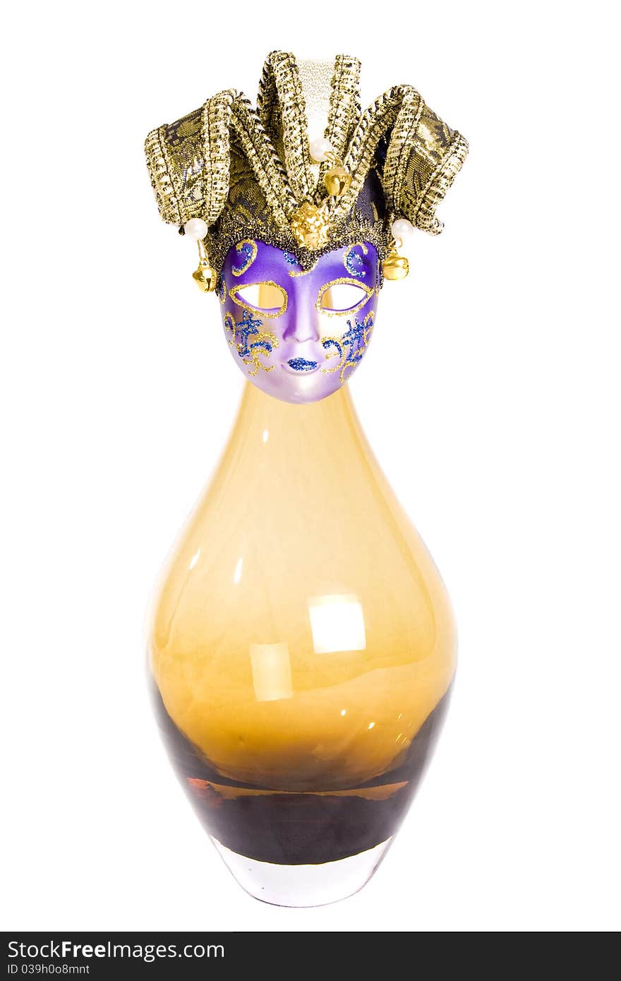 Glass vase with old-fashioned mask