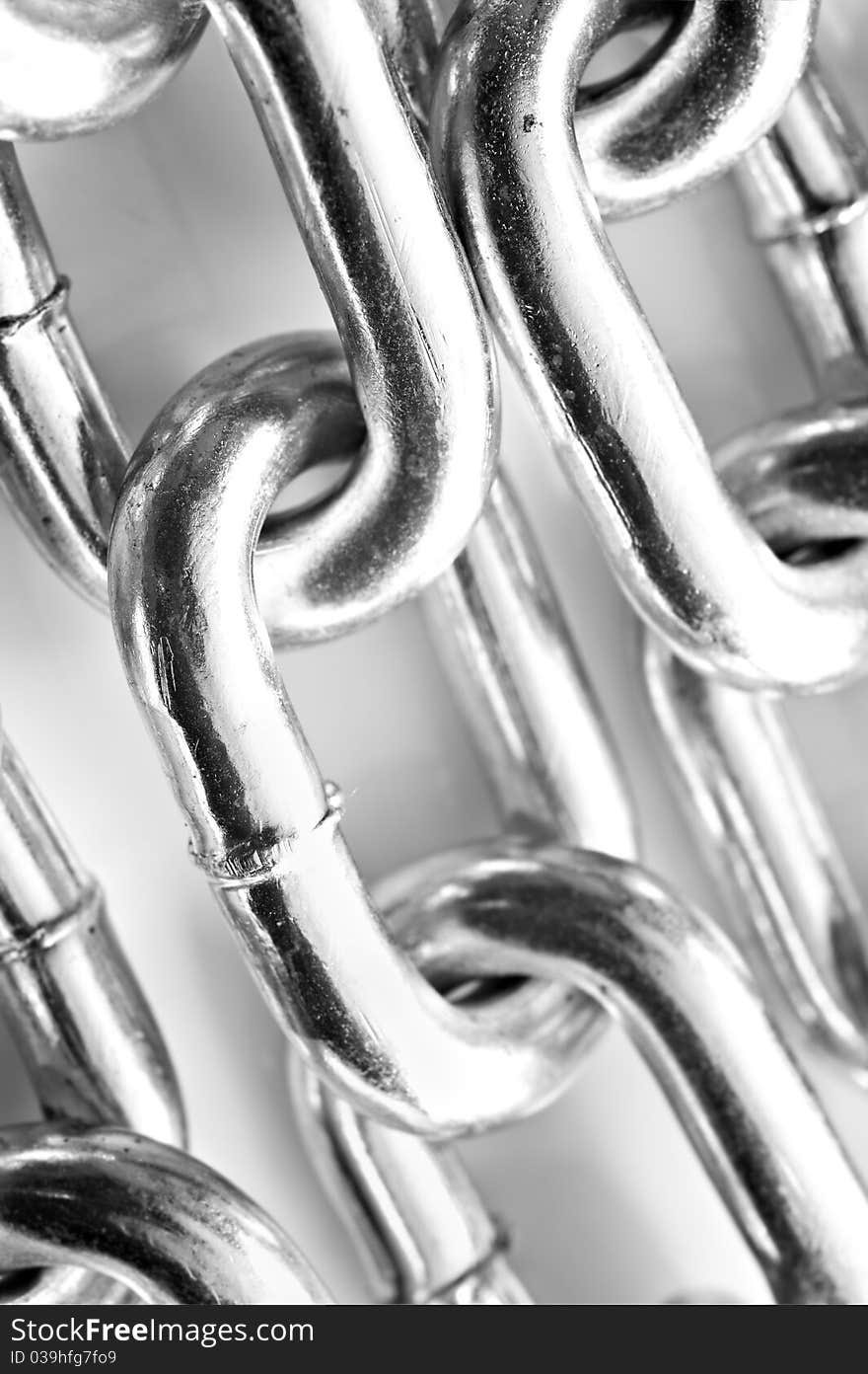 Abstract background of a silver chain on grey