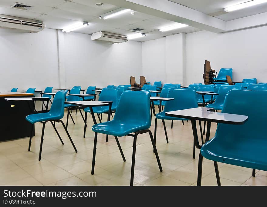 Empty room wth many armchairs can be use as classroom or metting room