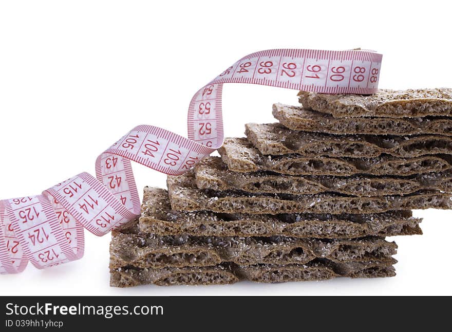 Stack of brown crisp with metre for waist. Stack of brown crisp with metre for waist