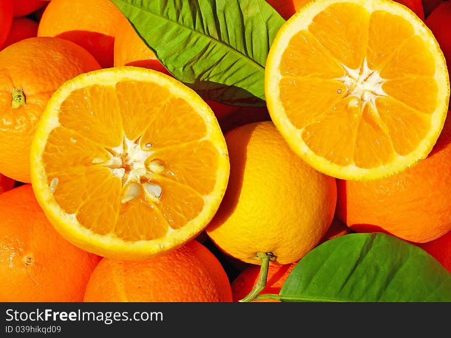 Sliced oranges in orange background. Sliced oranges in orange background.