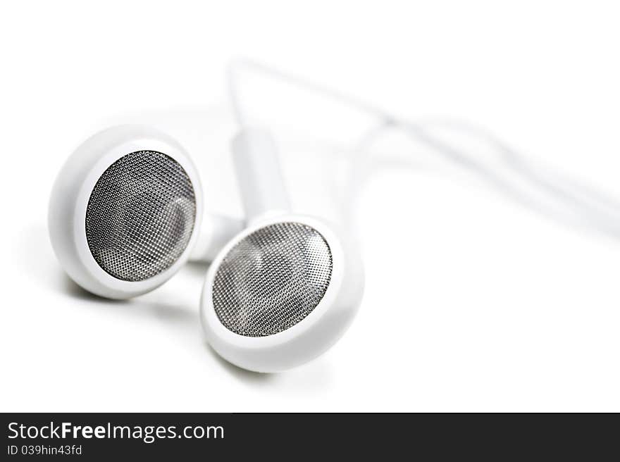 White earphones on a white background with space for text