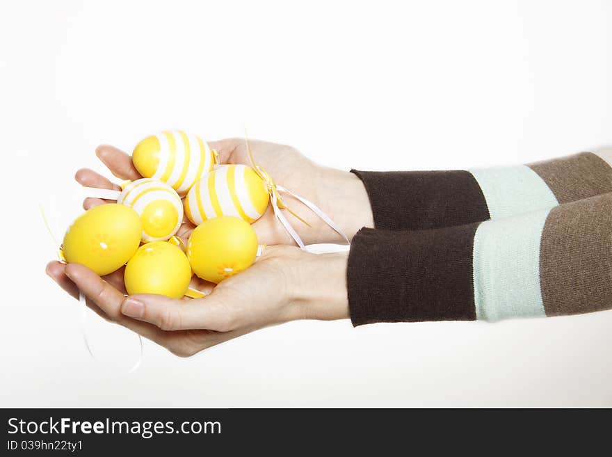 Woman hands with decorated easter eggs