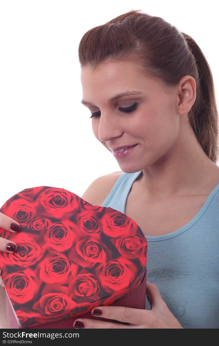 Sexy woman with heart shaped present surprised