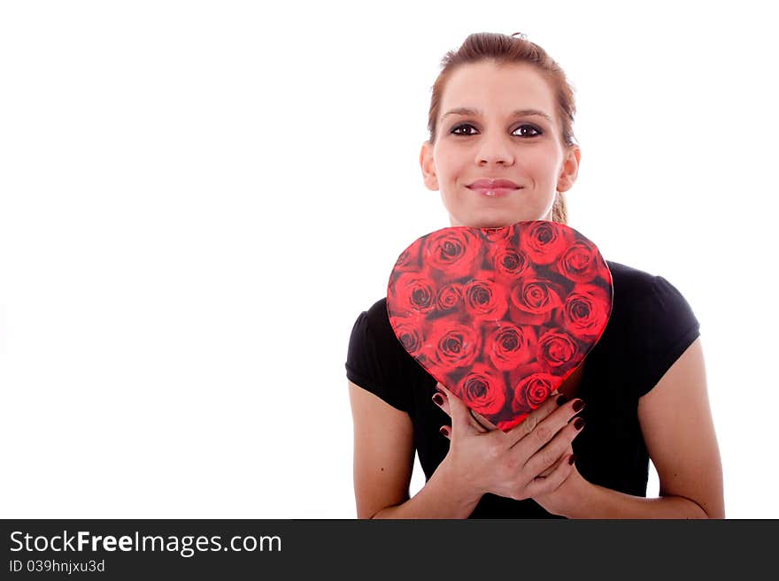 woman with heart shaped present surprised. woman with heart shaped present surprised