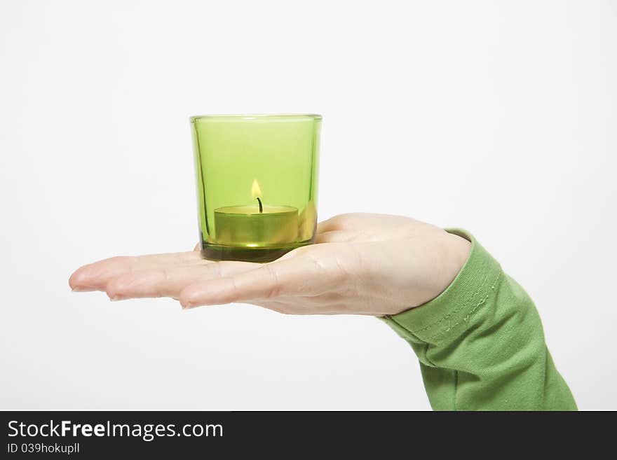 Hand with candle on white background