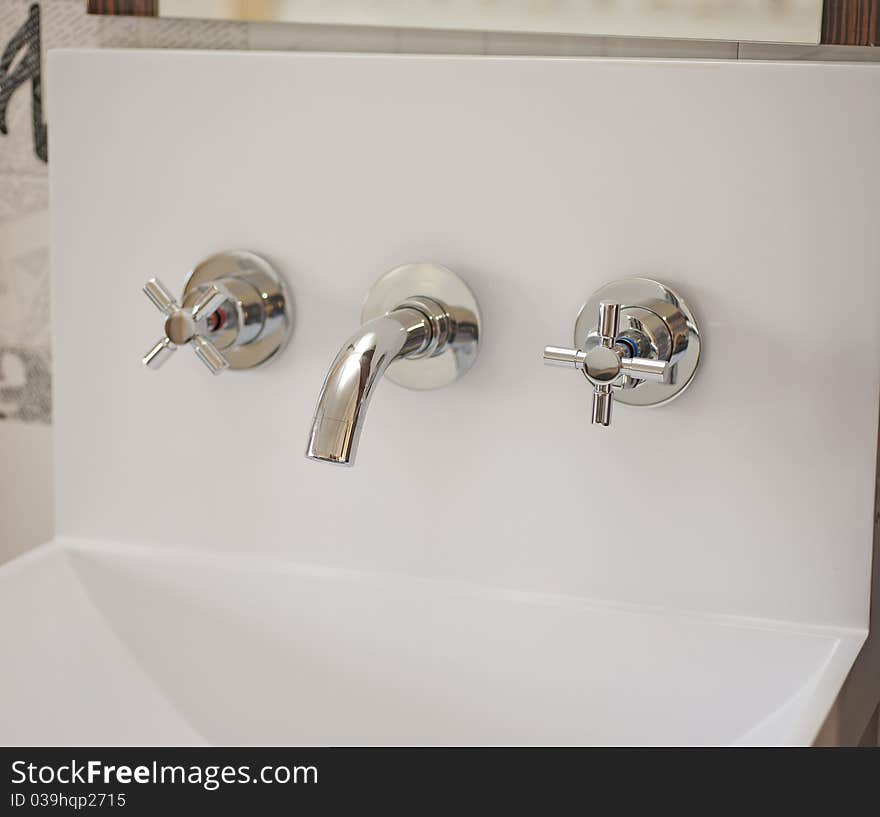 Washbasin tap in a bathroom. Washbasin tap in a bathroom