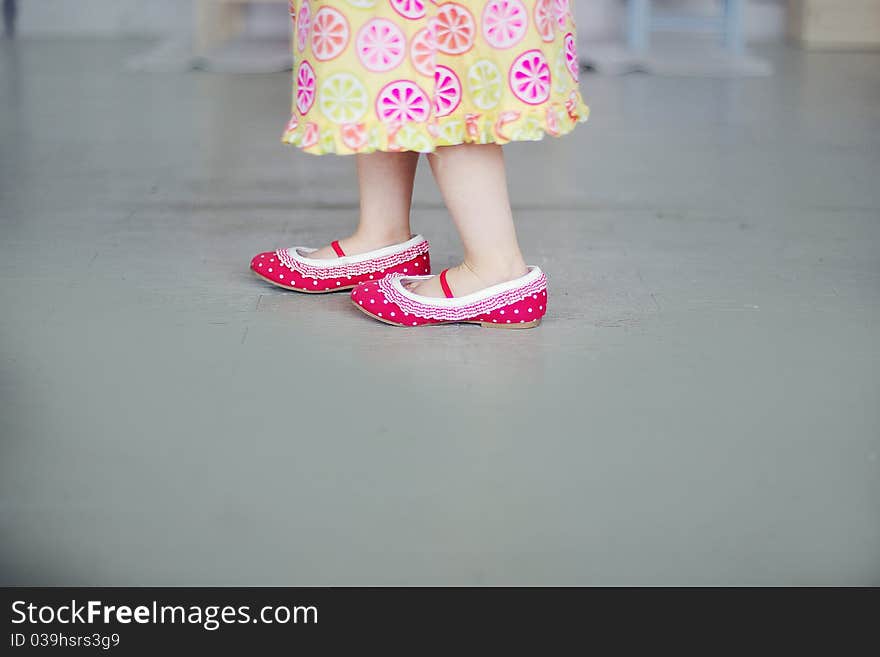 Small girl is dressing-up in pink