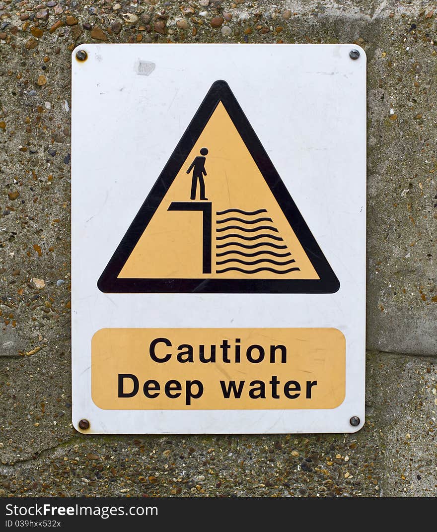 Caution deep water sign on wall