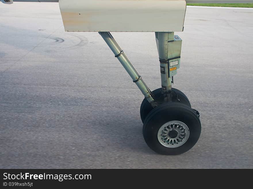 Aeroplane wheel static on runway.