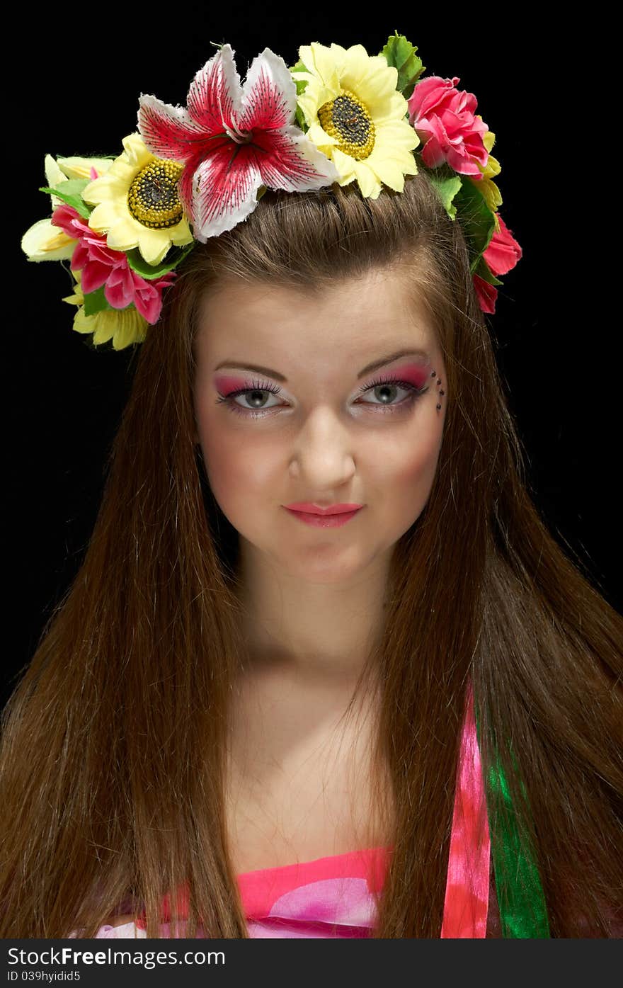 Portrait of a young girl with a wreath of flowers