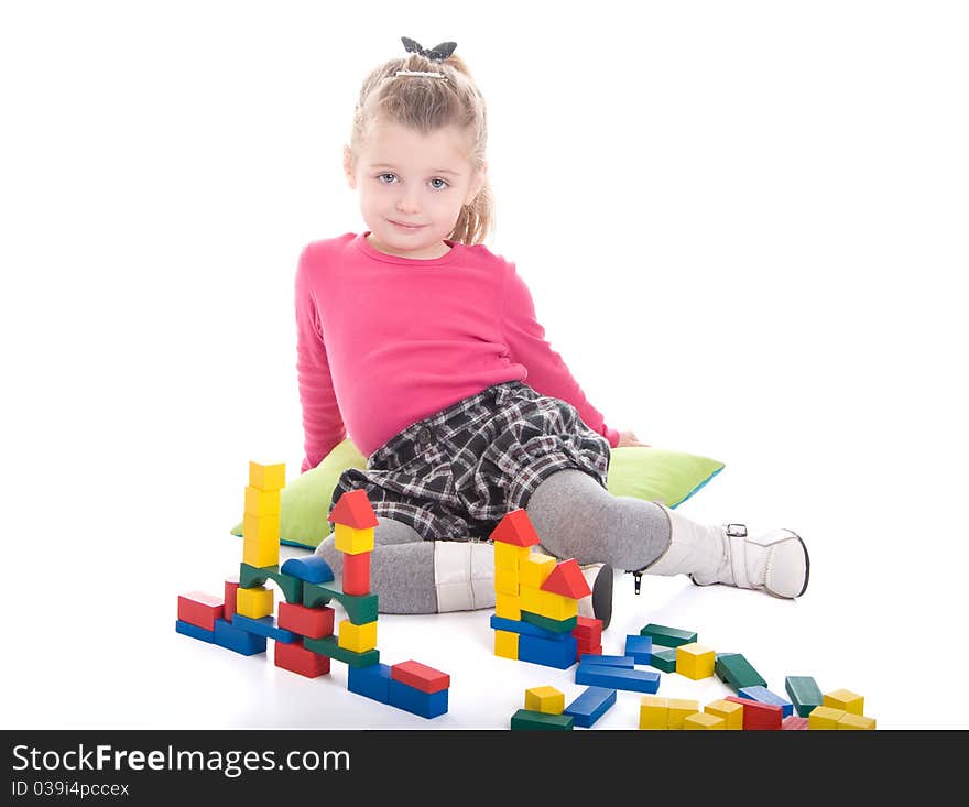 Little girl playing with cubes