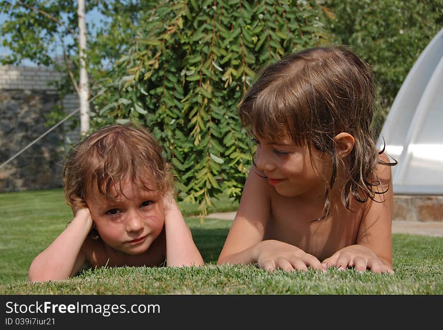 Two little girls playing in garden. Two little girls playing in garden