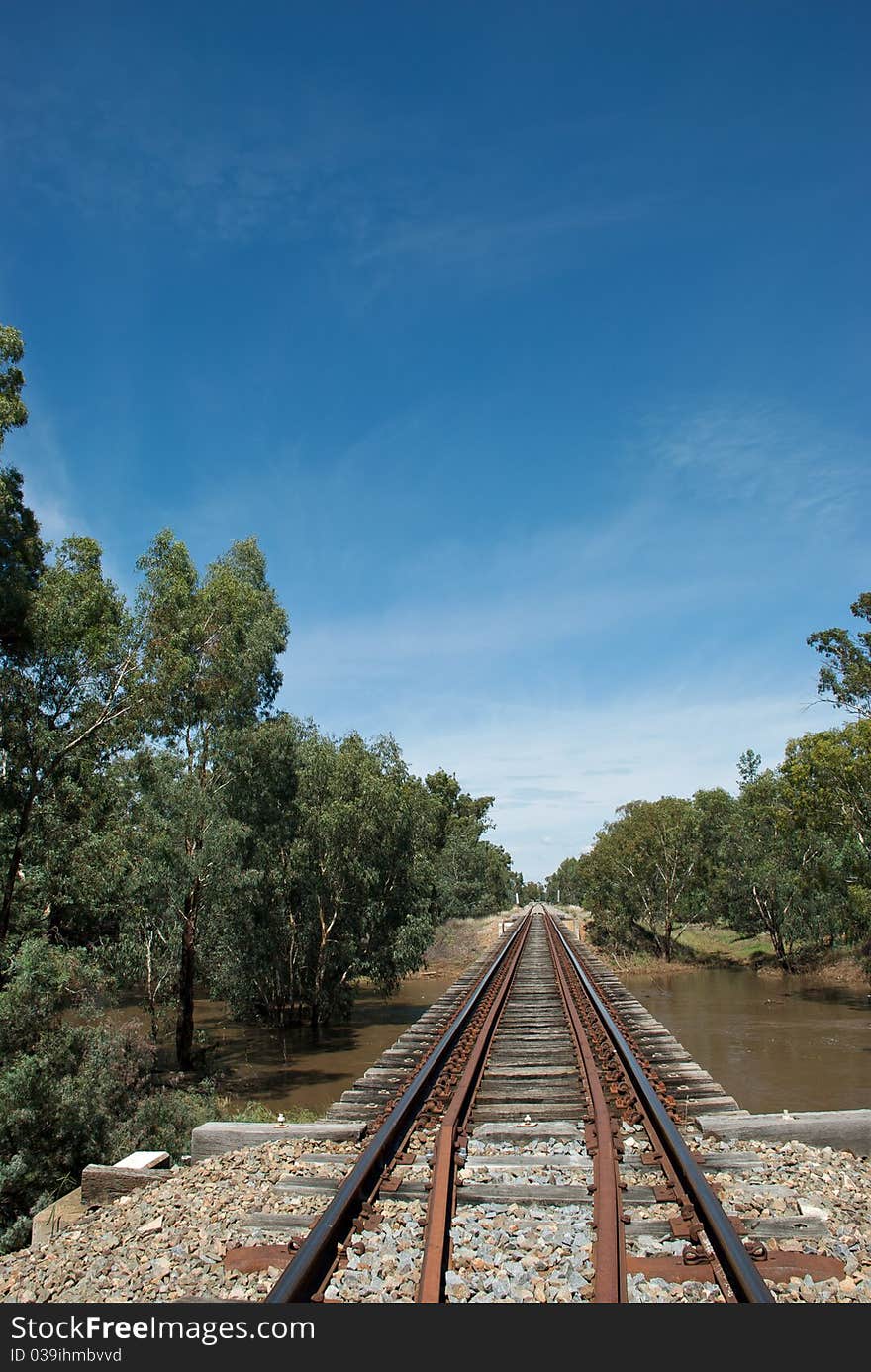 A railway line over a local creek. A railway line over a local creek