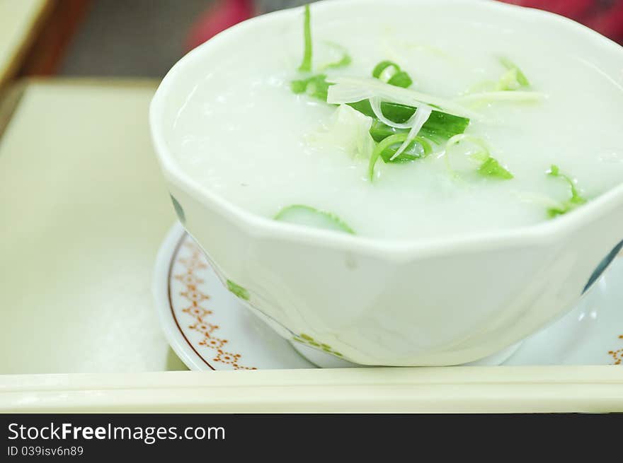 Rice porridge, jook in white bowl