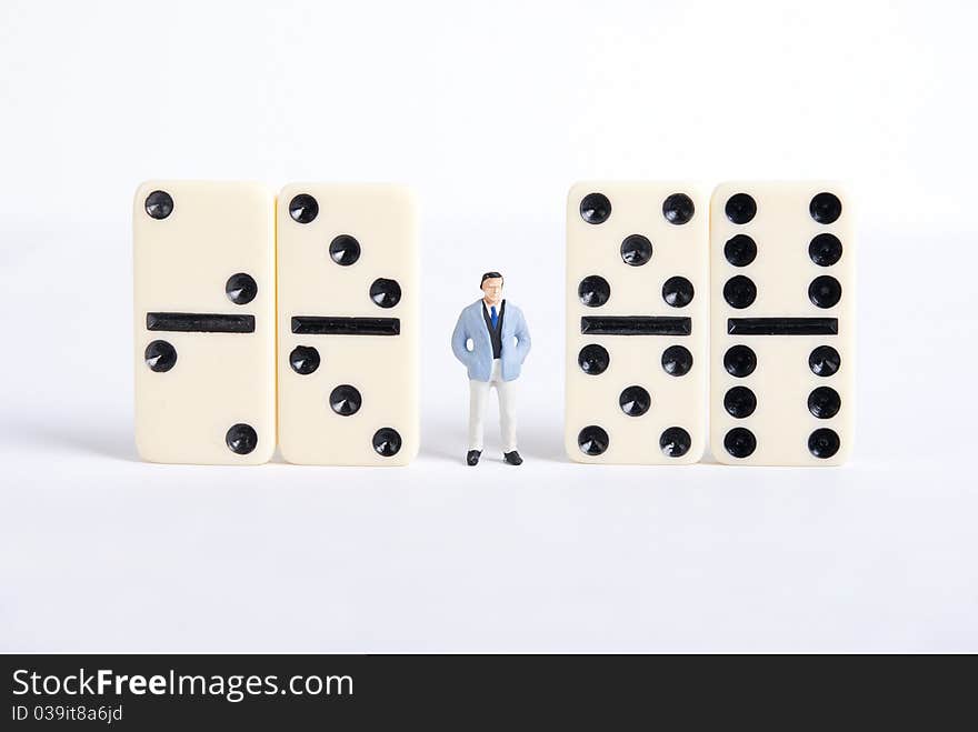 One man standing on pile of domino cubes