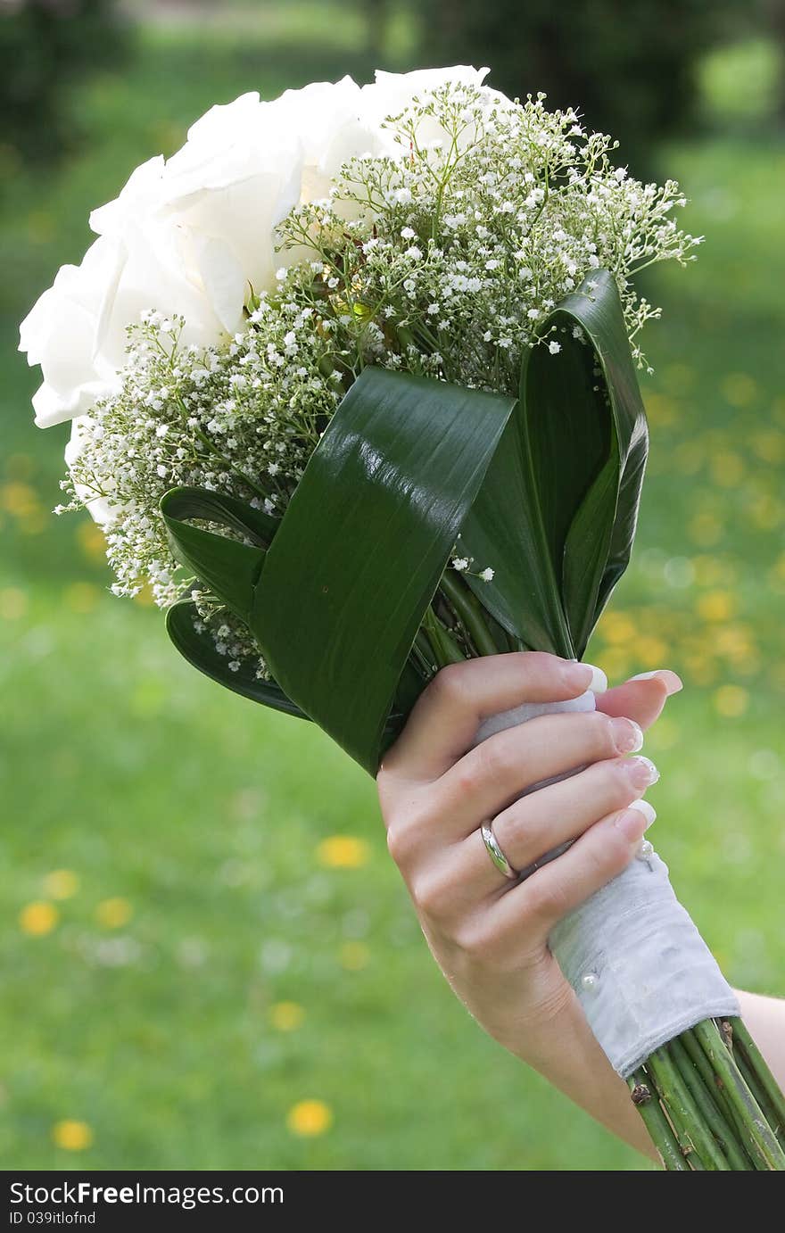 Bouquet of roses in hand