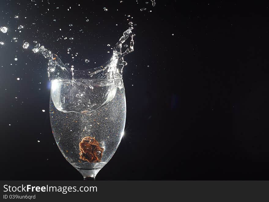 crown Plum splashing glass water