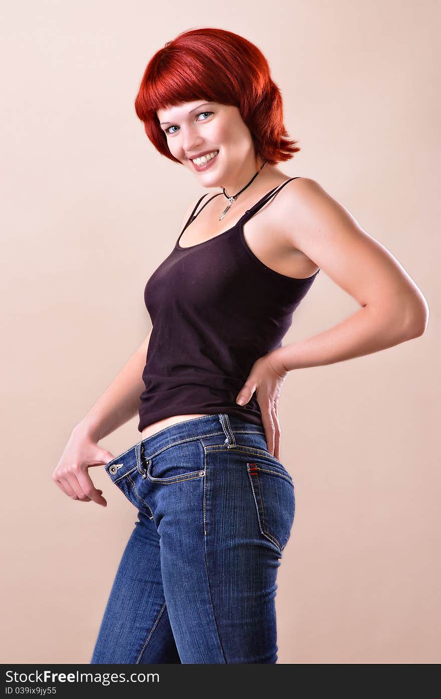 Portrait of the girl on a light grey background