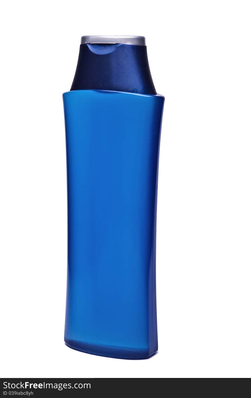 Dark blue plastic  bottle on a light background