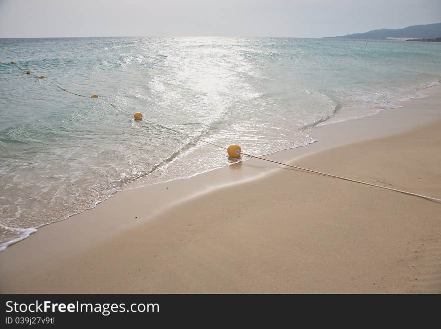 Beach with rope and buoy