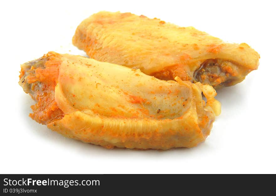 Close-up cooked chicken wings isolated on white