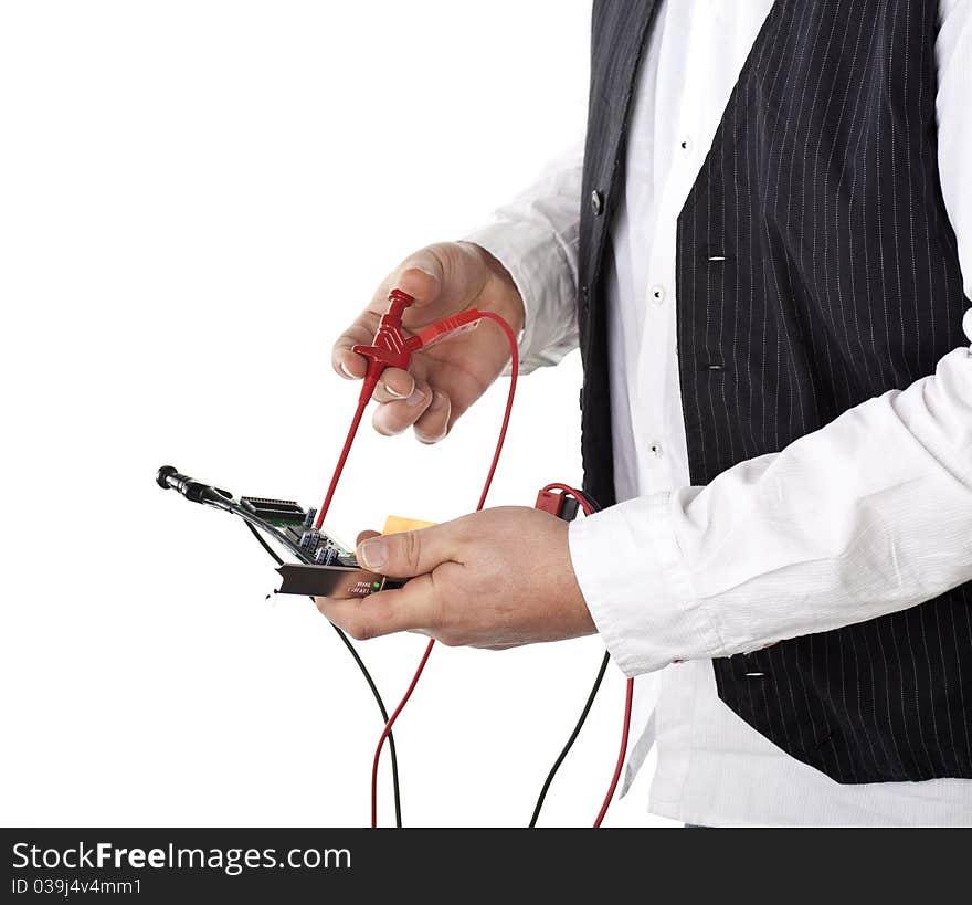 Male analyze some electronic parts, isolated on white background