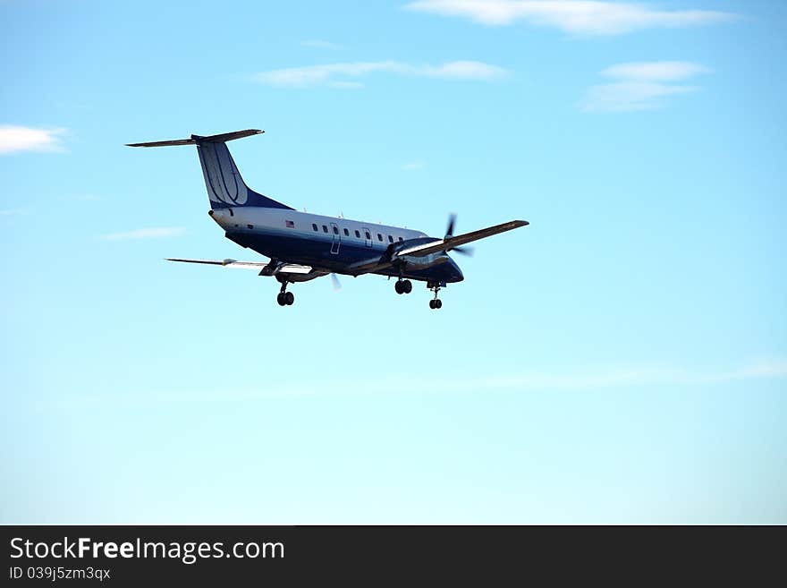 A twin engine propeller passenger aircraft preparing for landing at PDX Portland airport. A twin engine propeller passenger aircraft preparing for landing at PDX Portland airport.