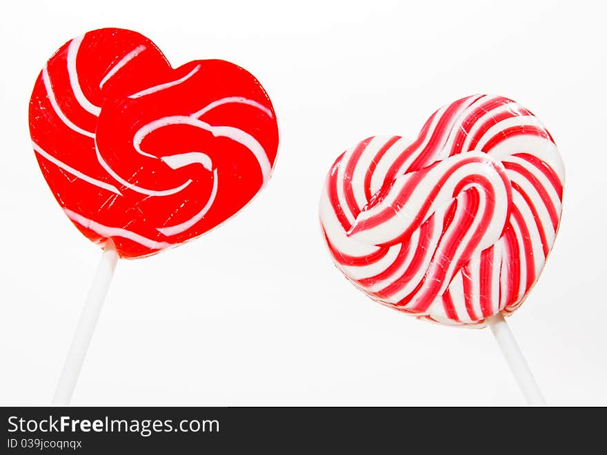 Retro style red , pink heart shape lollipop