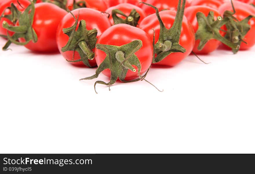 Studio photo of cherry tomatoes, isolated on white background