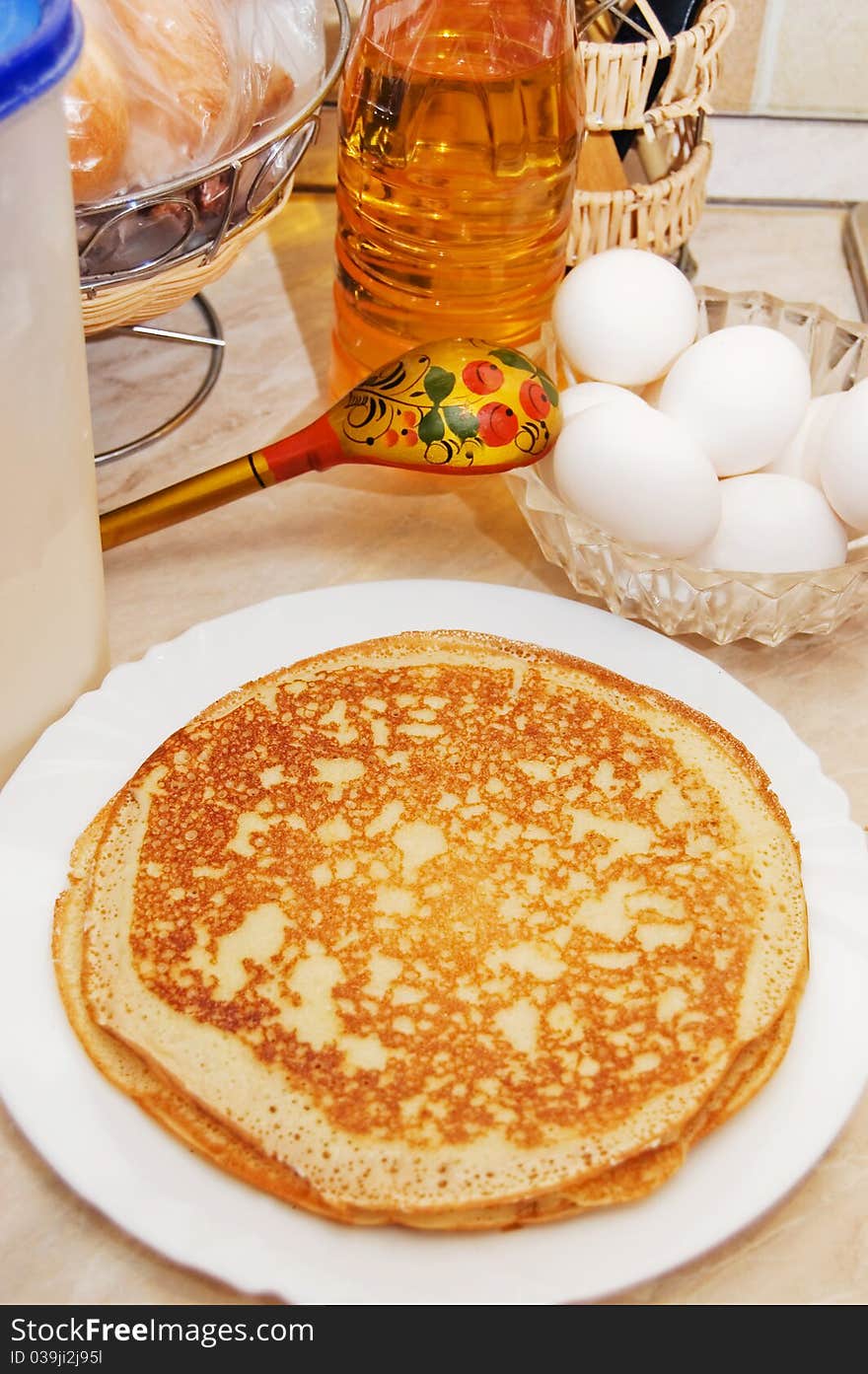 Plate with pancakes on a table closeup