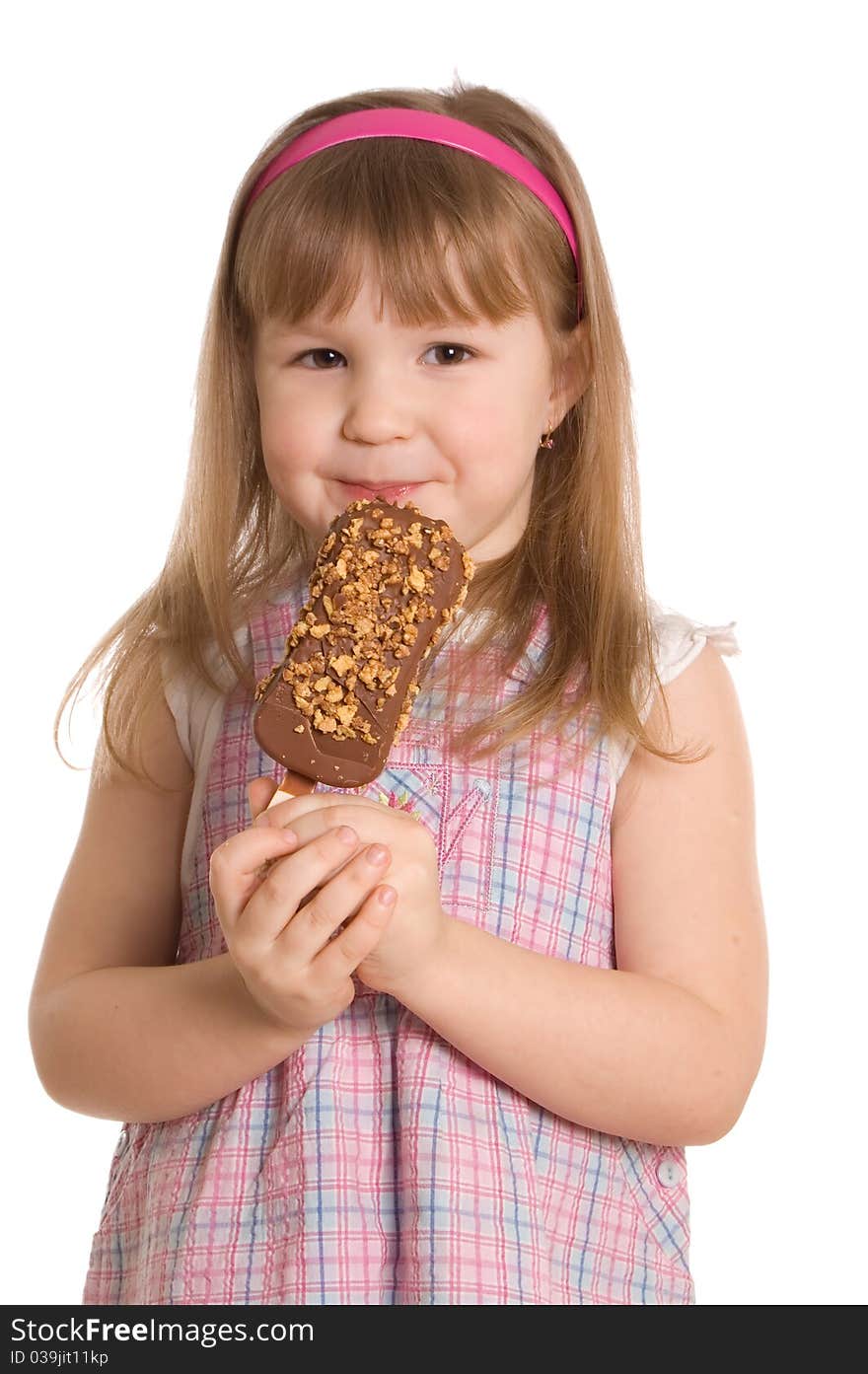 The little girl eats ice-cream on white