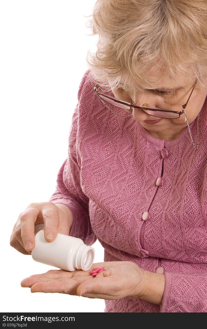 The elderly woman with tablets