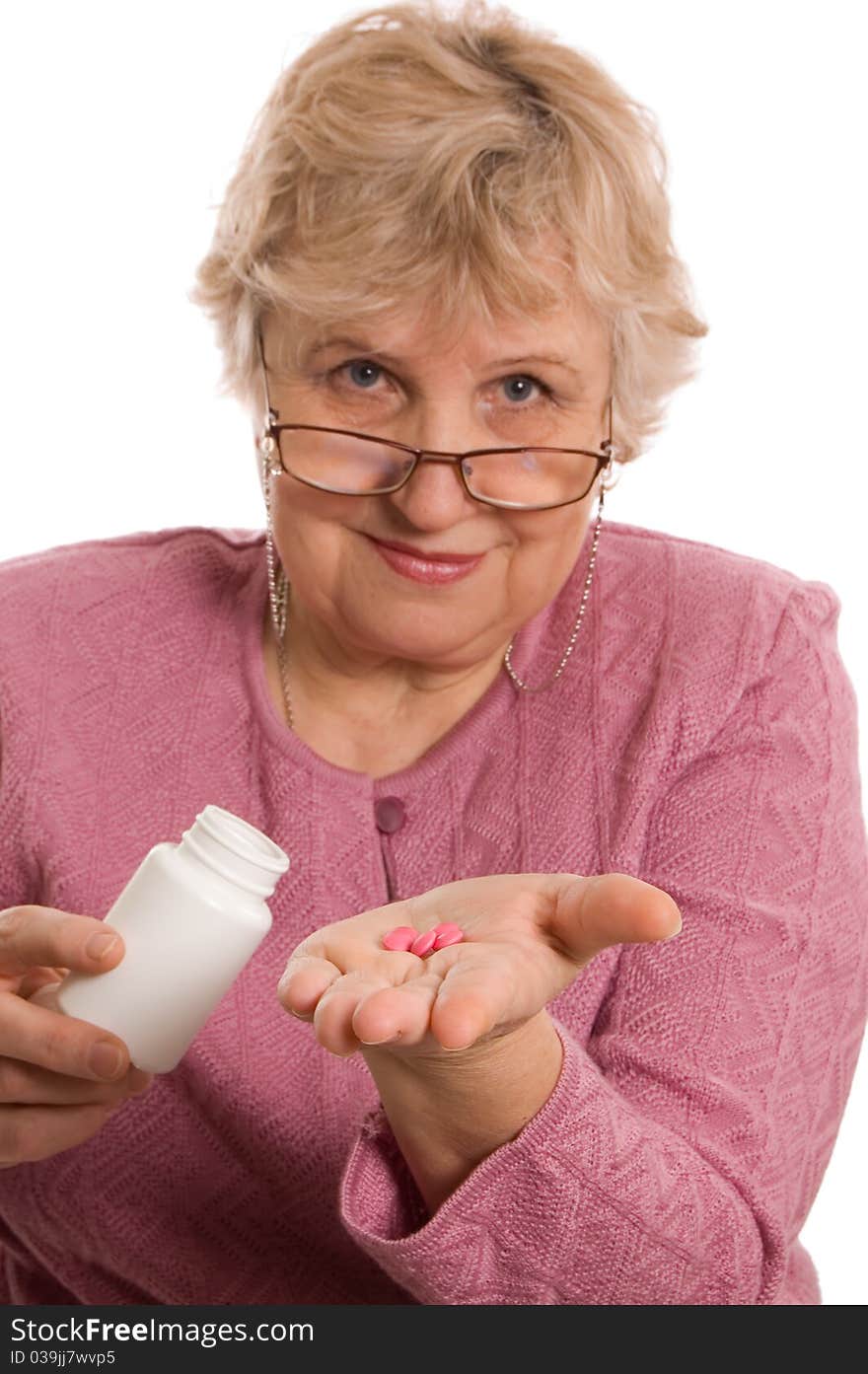 The elderly woman with tablets on white