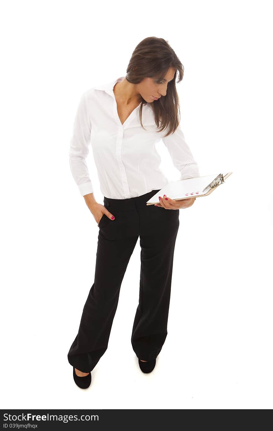 Business Woman in white blouselooking at a clipboard