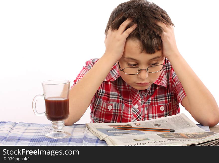 Kid in glasses reading newspaper. Kid in glasses reading newspaper