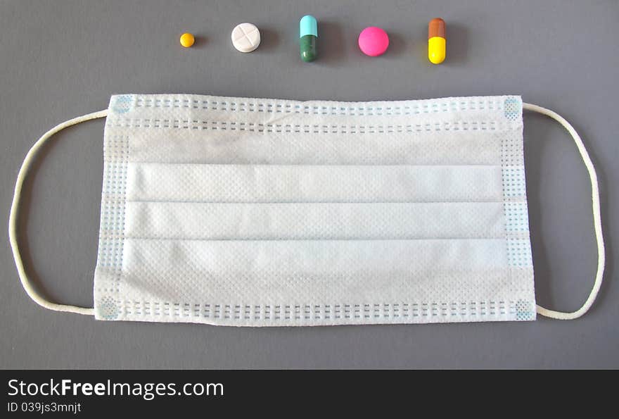 Set of various medical pills and mask