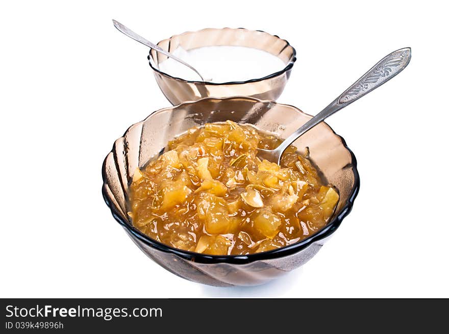 Jam and cream in a glass on a white background